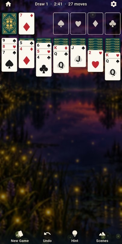 Bayou Solitaire screenshot — a Klondike game with fireflies drifting over the table